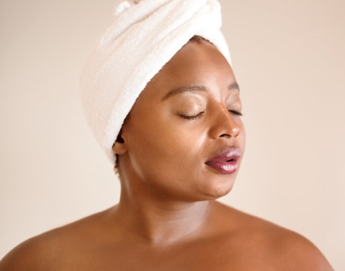 newtown facial treatments model in towel head wrap